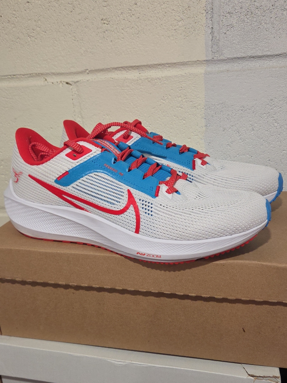 Nike Men's White Running Shoes with Red and Blue Accents
